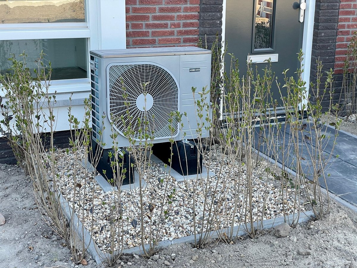 Residential outdoor AC condenser on a house pad